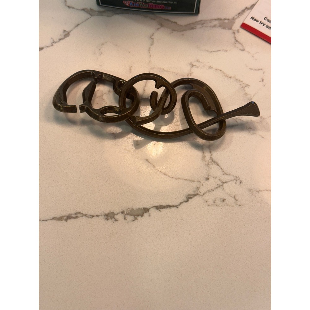 Hanayama Enigma Level 6 Cast Metal Brain Teaser Puzzle BePuzzled 30861 - Picture 4 of 5